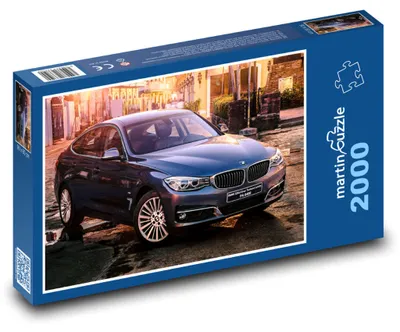 Produktbild von Puzzle 2000 Blaues Sportauto in der Stadt - martinpuzzle