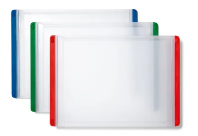 Three cutting boards are stacked diagonally on a white background. The cutting boards are white with colored edges: blue, green, and red.