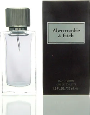 A bottle of Abercrombie & Fitch First Instinct Eau de Toilette for Men and its packaging are displayed against a white background.