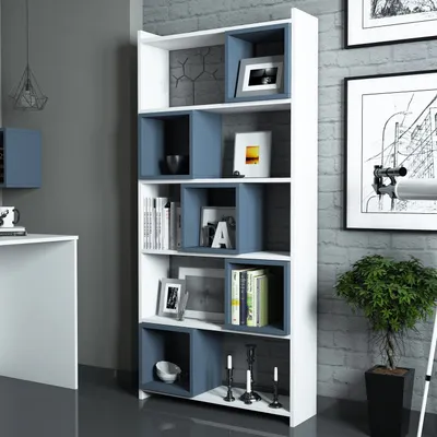A modern living room with a white and blue bookshelf filled with books and decorative items.