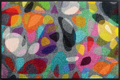 A colorful abstract pattern on a doormat.