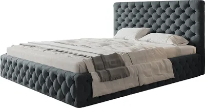 A dark gray upholstered bed with a tufted headboard and footboard, covered with white and gray bedding.
