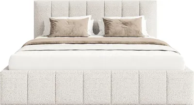 A bed with a headboard and frame upholstered in a textured white fabric, with two pillows and a throw blanket on top.