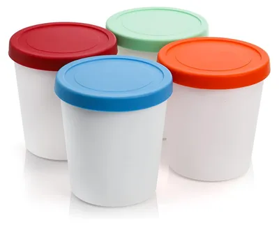 Four ice cream containers with different colored lids are arranged in a group on a white background.