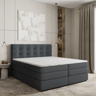 A modern bedroom setting with a bed as the main focus.