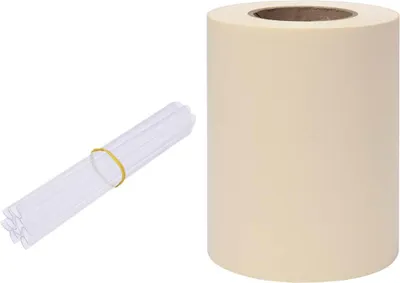 A roll of cream-colored material and a bundle of clear plastic tubes tied with a yellow rubber band are shown against a white background.