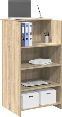 A light brown wooden reception desk with a laptop, binders, and storage boxes.