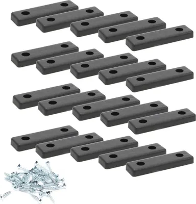 A collection of black furniture glides and screws arranged on a white background.