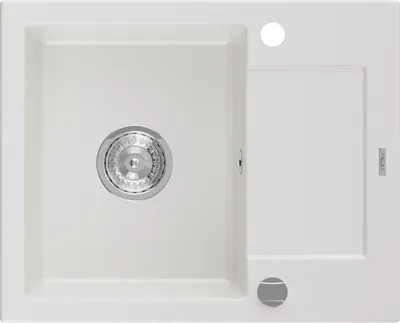 A top-down view of a white granite kitchen sink with a drain and a small drying area.