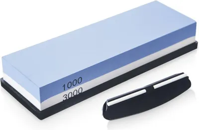 A sharpening stone with two grit sides and a black holder.