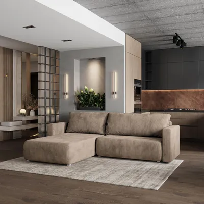 A modern living room and kitchen area with a sectional sofa in the foreground.