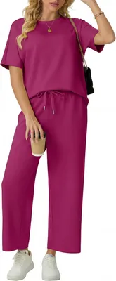Productafbeelding van Tweedelig dames joggingpak met shirt met korte mouwen en wijde broek met zakken, roze, maat S