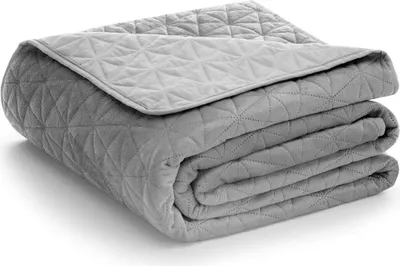 A folded gray blanket on a white background.