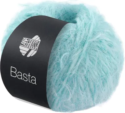 A ball of fuzzy yarn with a black label.