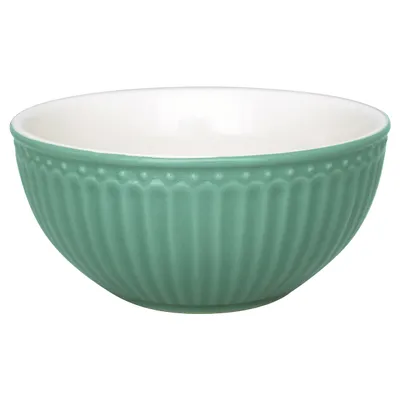 A single green bowl shown from the side against a white background.