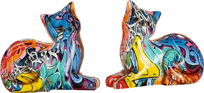 Two colorful cat figurines with graffiti-style art.