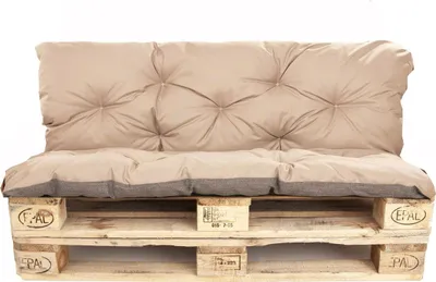 A sofa cushion set on a wooden pallet.