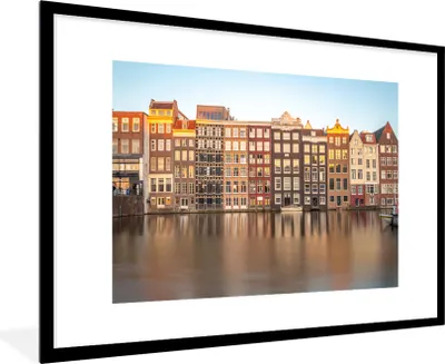 Produktbild von MuchoWow® Gerahmtes Poster Grachtenhäuser in Amsterdam unter blauem Himmel 90x60 cm - Poster mit Schwarzem Bilderrahmen Wandposter Rahmen Foto Bilder - Wanddekoration - Fotos