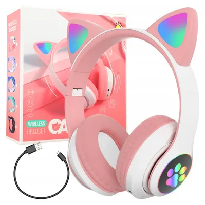 A pink wireless headset with cat ears and LED lights, shown with its charging cable and packaging in the background.