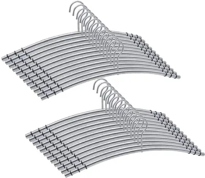 Two stacks of silver metal hangers against a white background.
