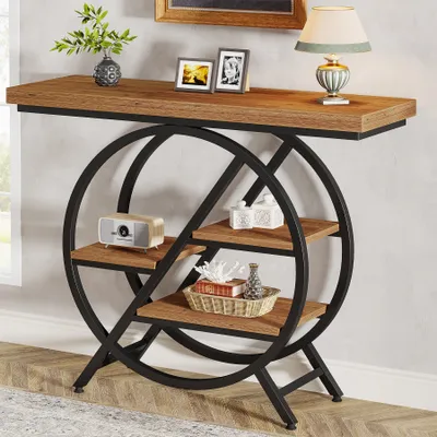 A console table with a wooden top and a geometric metal frame with shelves, decorated with various items.
