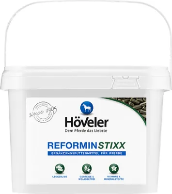 A white bucket of Höveler Reformin Stixx for horses.