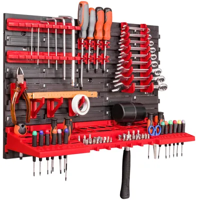 A wall-mounted tool organizer with various tools displayed.