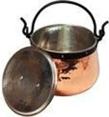 A copper pot with a lid next to it, on a white background.