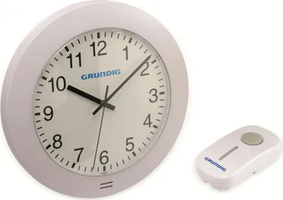 A white analog wall clock and a white remote control are shown against a white background.