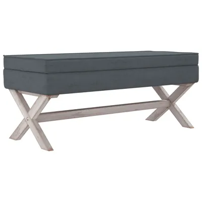A dark gray upholstered bench with a wooden X-frame base, shown against a white background.