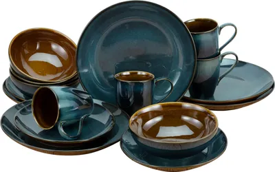 A collection of stoneware dinnerware, including plates, bowls, and mugs, arranged on a white background.