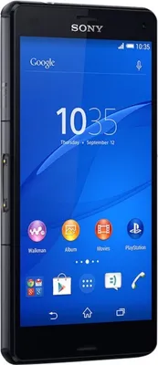A black Sony Xperia Z3 Compact smartphone is shown from a side-angle, displaying its screen with various app icons.