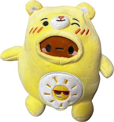 A yellow plush toy of a bear wearing a costume with a sun design on its belly.