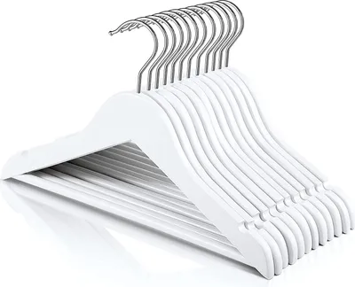 A stack of white wooden hangers with silver hooks, viewed from an angle.