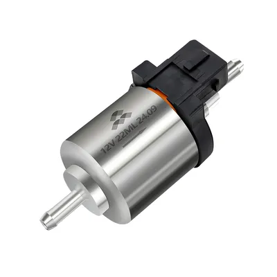 A close-up studio shot of a 12V fuel pump for a diesel heater.