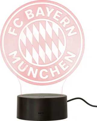 A red illuminated FC Bayern München logo lamp on a black base.