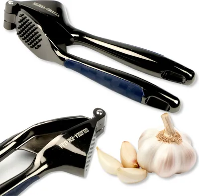 A product shot of a garlic press and garlic cloves on a white background.