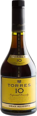 A bottle of Torres 10 Imperial Brandy against a white background.