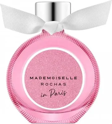 A pink perfume bottle with a white ribbon tied around the neck.