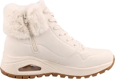 A side view of a beige SKECHERS sneaker boot with faux fur trim.
