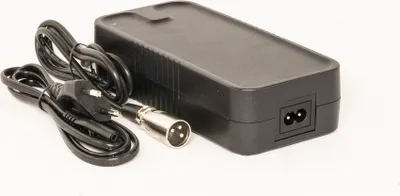 A black power adapter with cables and connectors is shown on a white background.