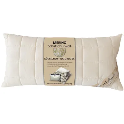 A cream-colored pillow with a label in the center.