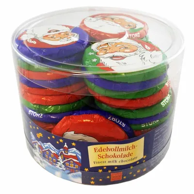 A clear, well-lit studio shot of a clear plastic container filled with individually wrapped chocolates.