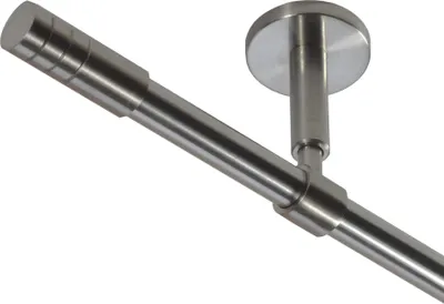 A close-up view of a metal curtain rod with a ceiling mount.