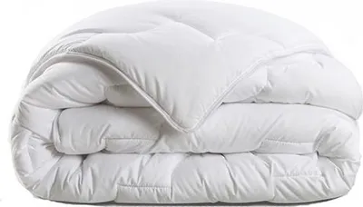 A folded white comforter is shown against a white background.