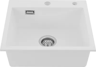 A white kitchen sink with a drain and faucet holes.