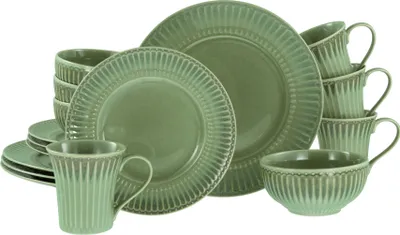 A set of green ceramic dishes including plates, bowls, and mugs, arranged on a white background.
