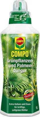 A bottle of plant fertilizer with green leaves depicted on the label.