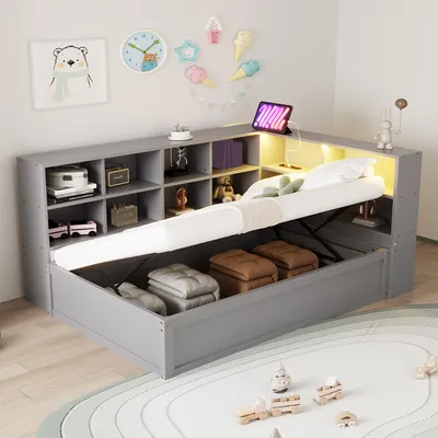 A grey multifunctional daybed with storage is shown in a child's room setting, with toys and decorations on the wall.