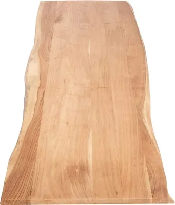 A top-down view of a wooden tabletop with a live edge.